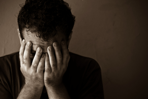 man struggling with sleep as his mattress is not cleaned